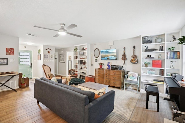 6803 Moonmont Dr, Austin, TX 78745 - living room with wood finished floors and a ceiling fan