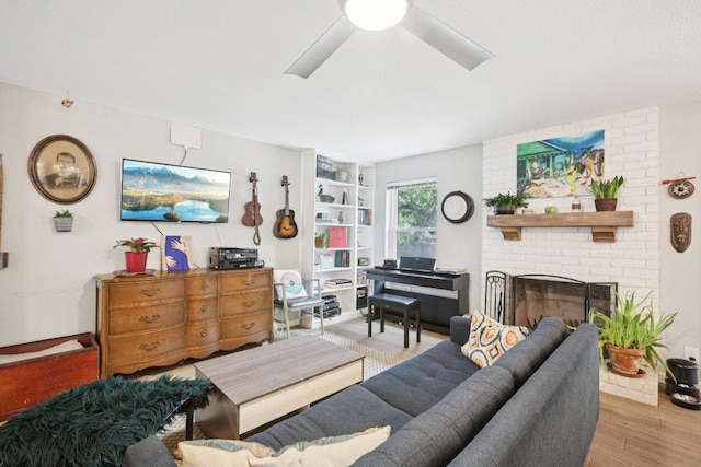 6803 Moonmont Dr, Austin, TX 78745 - living area featuring wood finished floors, a fireplace, and a ceiling fan