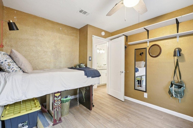 6803 Moonmont Dr, Austin, TX 78745 - bedroom with wood finished floors and a ceiling fan