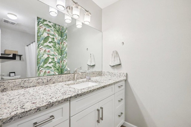 6803 Moonmont Dr, Austin, TX 78745 - full bath featuring vanity and baseboards