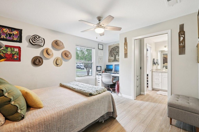 6803 Moonmont Dr, Austin, TX 78745 - bedroom with light wood-type flooring, ceiling fan, and built in study area