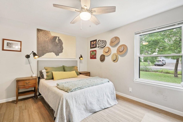 6803 Moonmont Dr, Austin, TX 78745 - bedroom with wood finished floors and a ceiling fan
