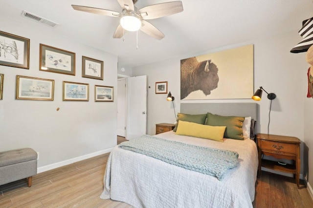 6803 Moonmont Dr, Austin, TX 78745 - bedroom featuring wood finished floors and ceiling fan