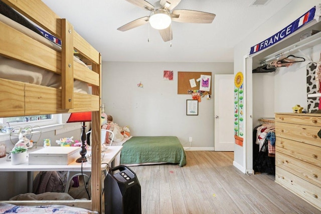 6803 Moonmont Dr, Austin, TX 78745 - bedroom featuring wood finished floors, ceiling fan, and a closet