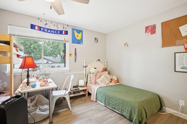 6803 Moonmont Dr, Austin, TX 78745 - bedroom featuring wood finished floors and a ceiling fan