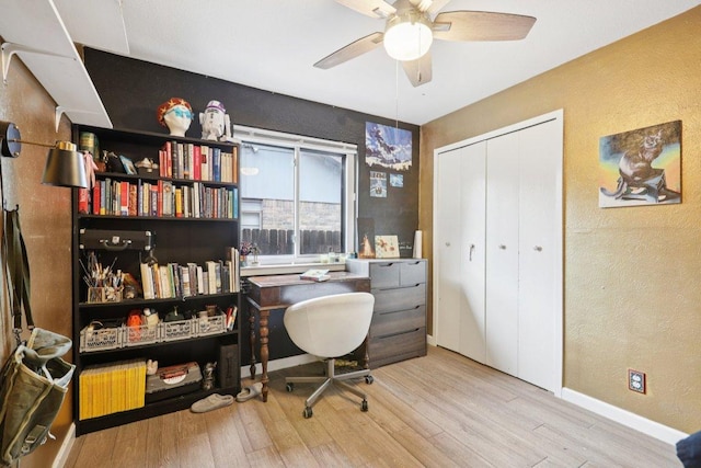 6803 Moonmont Dr, Austin, TX 78745 - home office featuring a textured wall, wood finished floors, and ceiling fan