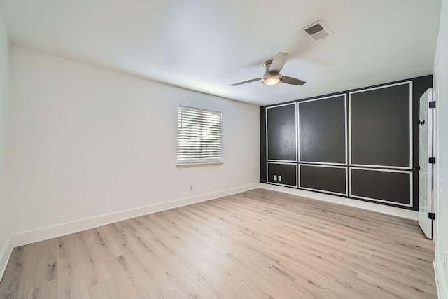 6102 Amber Pass, Austin, TX 78745 - unfurnished bedroom with wood finished floors and a ceiling fan