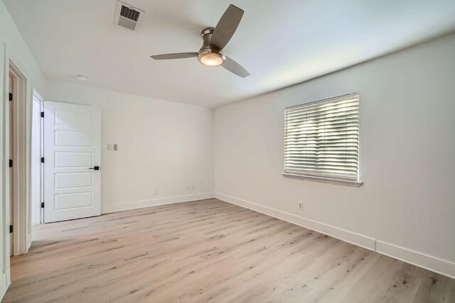 6102 Amber Pass, Austin, TX 78745 - spare room featuring light wood-style floors, a ceiling fan, and a smoke detector