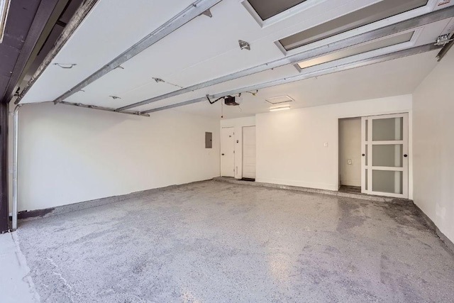 6102 Amber Pass, Austin, TX 78745 - garage with a garage door opener and electric panel