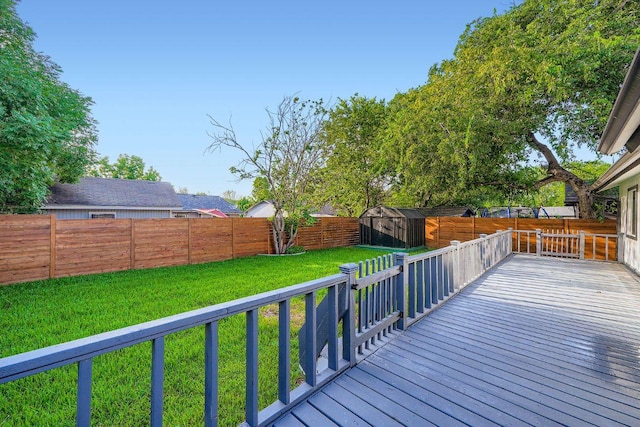 6102 Amber Pass, Austin, TX 78745 - wooden deck with a storage unit and a fenced backyard