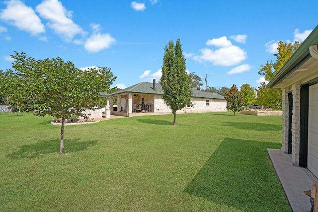 213 S Buffalo Pass, Georgetown, TX 78633 - view of grassy yard with a patio