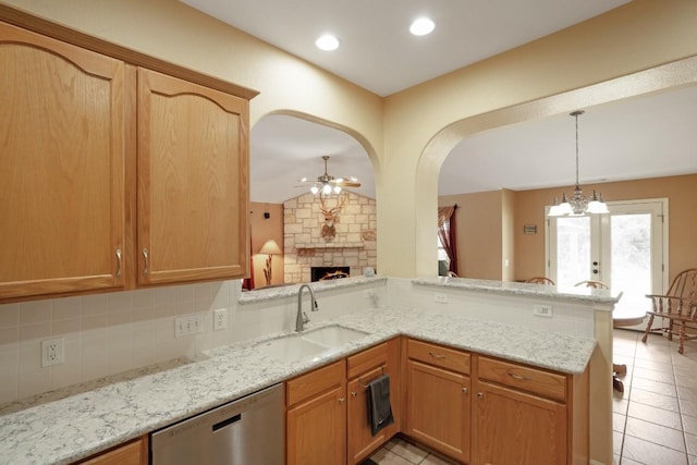 213 S Buffalo Pass, Georgetown, TX 78633 - kitchen featuring dishwasher, a ceiling fan, light tile patterned flooring, a peninsula, and tasteful backsplash