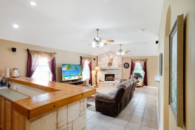 213 S Buffalo Pass, Georgetown, TX 78633 - living room featuring ceiling fan, lofted ceiling, light tile patterned floors, a fireplace, and recessed lighting