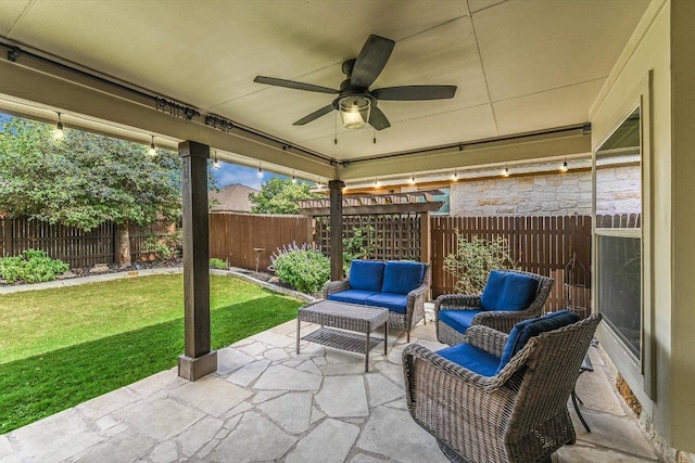 609 Joppa Rd, Leander, TX 78641 - fenced backyard featuring a patio area, ceiling fan, and an outdoor living space