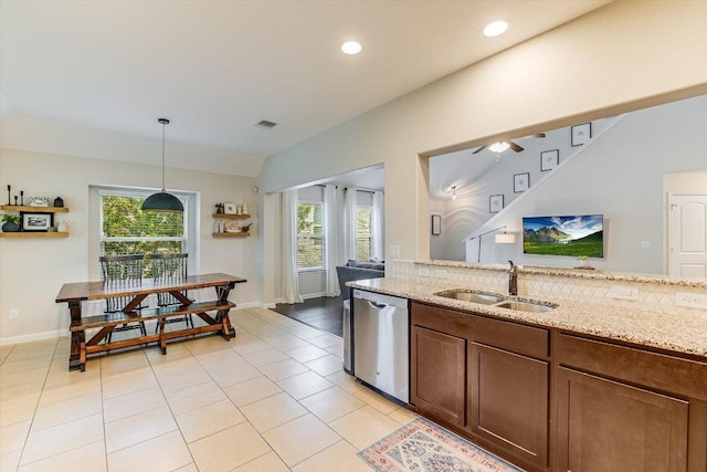 609 Joppa Rd, Leander, TX 78641 - kitchen with stainless steel dishwasher, plenty of natural light, light stone counters, pendant lighting, and recessed lighting