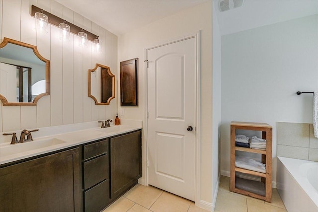 609 Joppa Rd, Leander, TX 78641 - full bathroom featuring tile patterned flooring, double vanity, and a tub to relax in