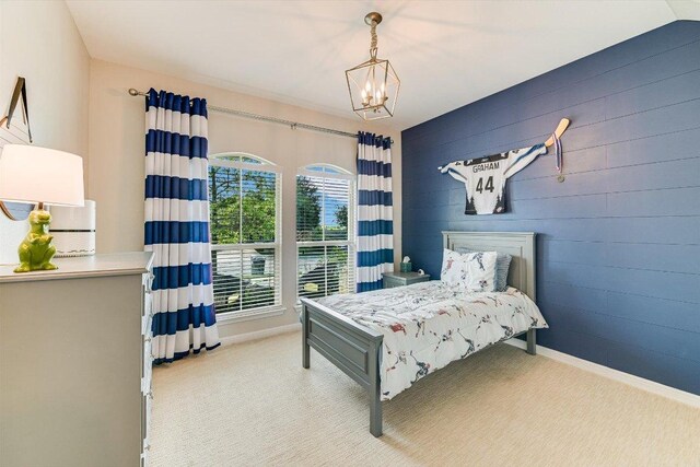 609 Joppa Rd, Leander, TX 78641 - carpeted bedroom with a chandelier and baseboards