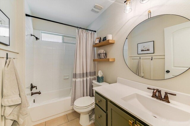 609 Joppa Rd, Leander, TX 78641 - bathroom featuring vanity, shower / bathtub combination with curtain, and tile patterned floors