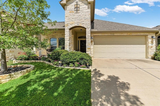 609 Joppa Rd, Leander, TX 78641 - french provincial home featuring stone siding, driveway, a front lawn, and roof with shingles
