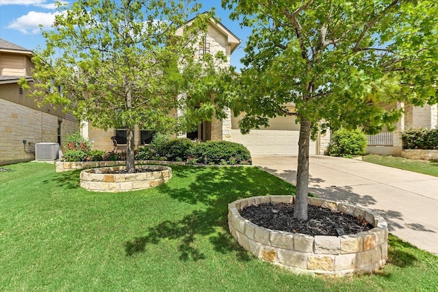 609 Joppa Rd, Leander, TX 78641 - view of grassy yard featuring driveway and an attached garage