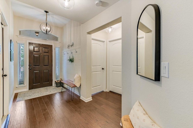609 Joppa Rd, Leander, TX 78641 - foyer entrance featuring dark wood-style flooring and baseboards