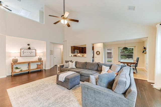 609 Joppa Rd, Leander, TX 78641 - living area with ceiling fan, high vaulted ceiling, and dark wood-style floors