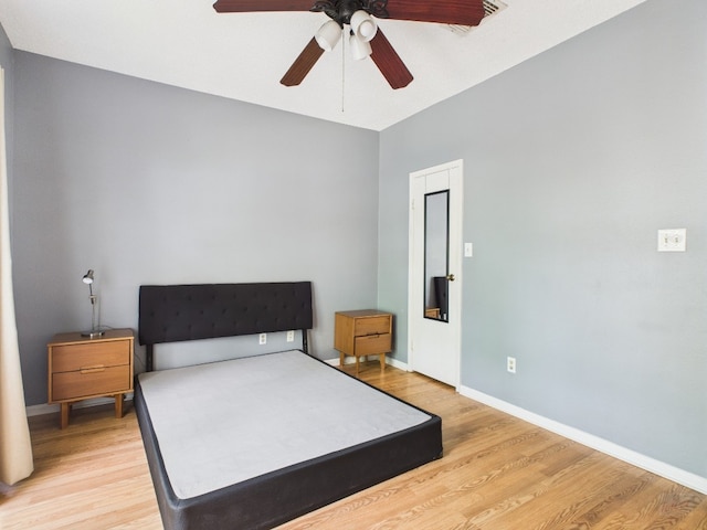 2901 San Jacinto Blvd Unit 110, Austin, TX 78705 - bedroom with light wood finished floors and ceiling fan