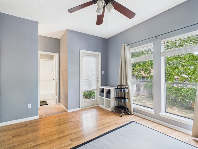 2901 San Jacinto Blvd Unit 110, Austin, TX 78705 - unfurnished room with wood finished floors and a ceiling fan