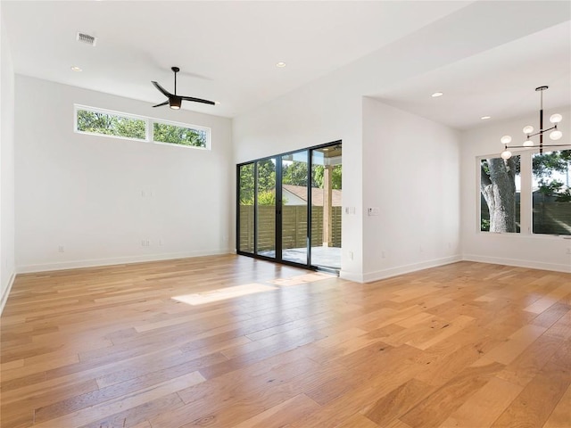 2005 Palo Duro Rd, Austin, TX 78757 - empty room featuring plenty of natural light, light wood finished floors, a chandelier, recessed lighting, and ceiling fan