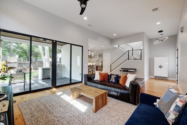 2005 Palo Duro Rd, Austin, TX 78757 - living area featuring stairs, light wood finished floors, and recessed lighting