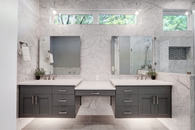 2005 Palo Duro Rd, Austin, TX 78757 - bathroom with vanity, a marble finish shower, tile walls, and tile patterned floors