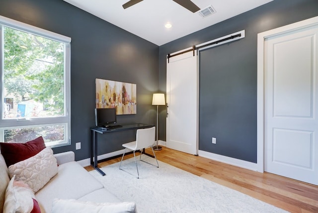 2005 Palo Duro Rd, Austin, TX 78757 - office area featuring a barn door, wood finished floors, and ceiling fan