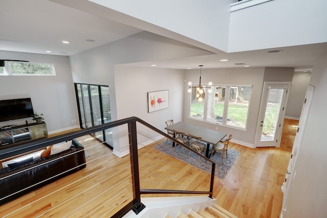 2005 Palo Duro Rd, Austin, TX 78757 - staircase featuring hardwood / wood-style flooring, a chandelier, and recessed lighting
