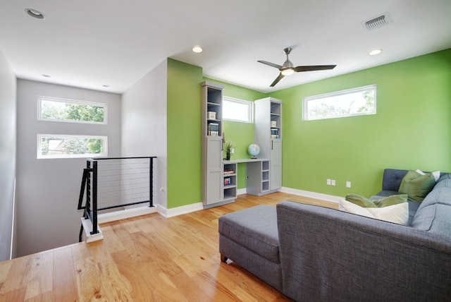 2005 Palo Duro Rd, Austin, TX 78757 - living area featuring light wood finished floors, plenty of natural light, a ceiling fan, and recessed lighting