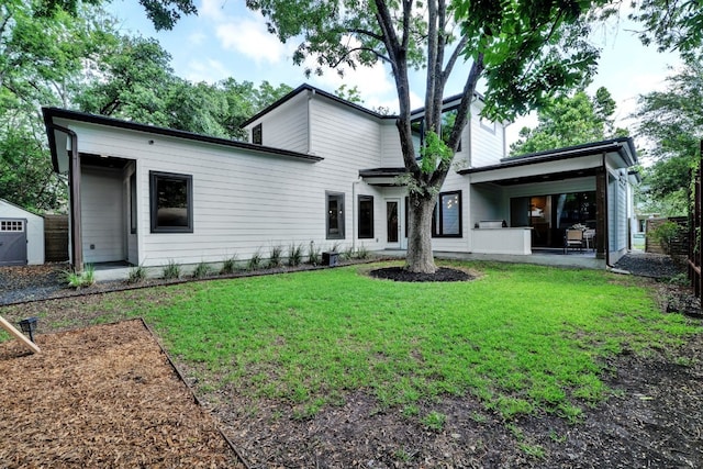 2005 Palo Duro Rd, Austin, TX 78757 - rear view of house featuring a yard and a patio
