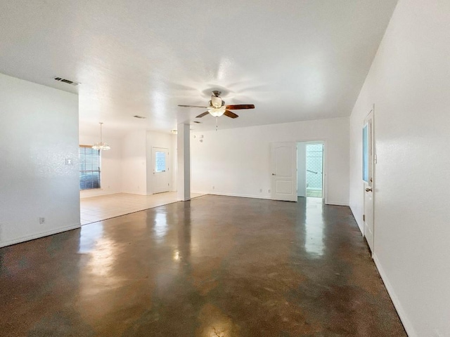303 Rowdy Dr, Killeen, TX 76542 - unfurnished living room with ceiling fan, a chandelier, and finished concrete flooring