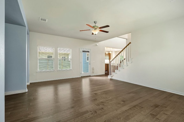 8821 Cattle Baron Path, Austin, TX 78747 - unfurnished living room featuring ceiling fan, dark wood-style flooring, and stairs