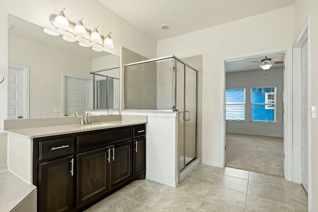 8821 Cattle Baron Path, Austin, TX 78747 - full bathroom with vanity, a shower stall, a ceiling fan, and tile patterned floors