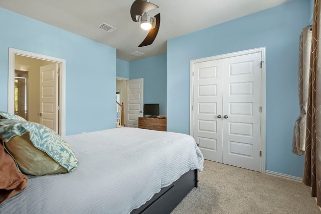 8821 Cattle Baron Path, Austin, TX 78747 - bedroom with light colored carpet, a closet, and a ceiling fan