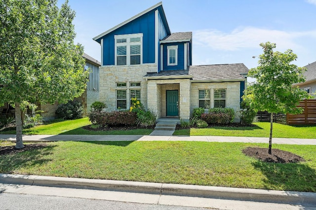 8821 Cattle Baron Path, Austin, TX 78747 - view of front of property featuring stone siding, board and batten siding, and a shingled roof