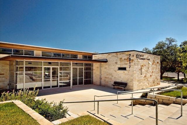 10320 Hansa Cv, Austin, TX 78739 - back of house with a patio area and a sunroom
