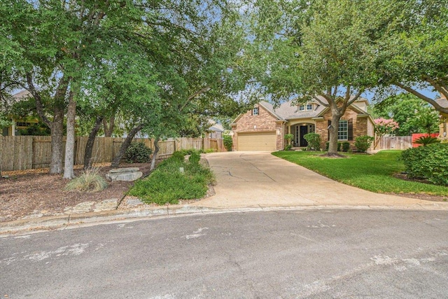 10320 Hansa Cv, Austin, TX 78739 - view of front of home featuring concrete driveway, a garage, and brick siding