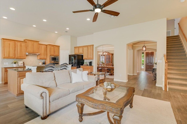 10320 Hansa Cv, Austin, TX 78739 - living area with arched walkways, stairway, light wood-type flooring, ceiling fan, and recessed lighting
