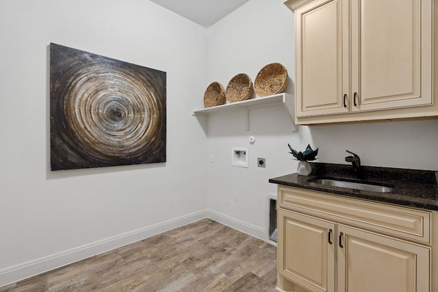 377 Bristlecone Dr, Driftwood, TX 78619 - washroom with light wood-type flooring, hookup for an electric dryer, hookup for a washing machine, and cabinet space