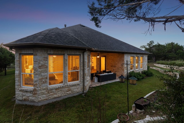 377 Bristlecone Dr, Driftwood, TX 78619 - rear view of property with stone siding, a shingled roof, and outdoor lounge area