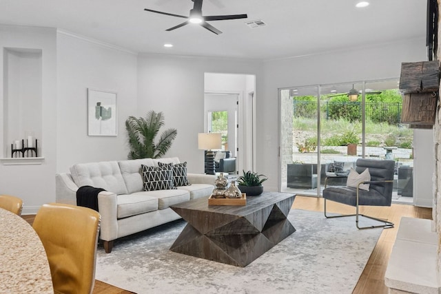 377 Bristlecone Dr, Driftwood, TX 78619 - living room featuring wood finished floors, ceiling fan, recessed lighting, and crown molding