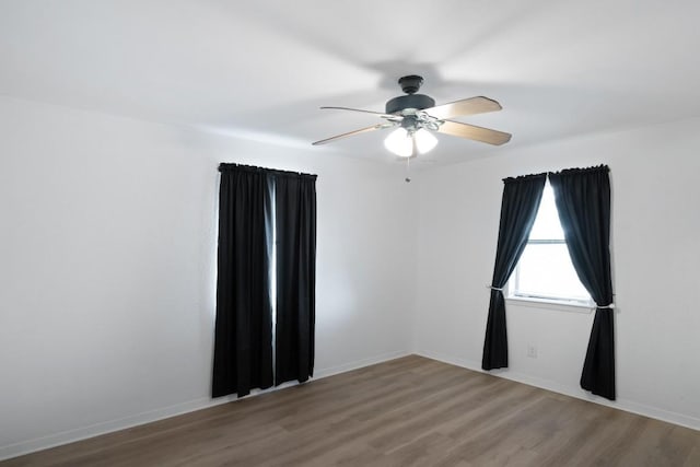1004 Scenic Dr, Georgetown, TX 78626 - spare room featuring wood finished floors and a ceiling fan