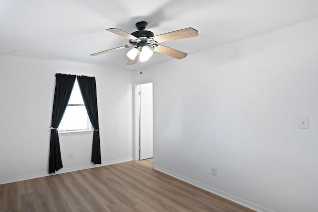 1004 Scenic Dr, Georgetown, TX 78626 - empty room featuring wood finished floors and a ceiling fan
