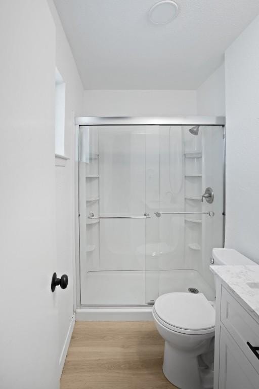 1004 Scenic Dr, Georgetown, TX 78626 - full bath with wood finished floors, a stall shower, and vanity