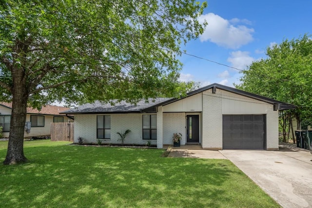 1004 Scenic Dr, Georgetown, TX 78626 - mid-century inspired home with brick siding, a garage, and concrete driveway